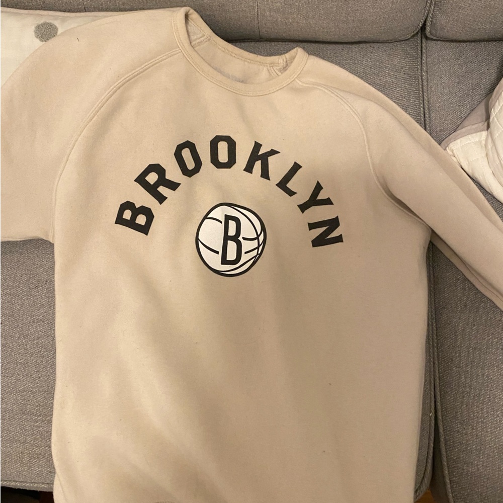 A Brooklyn Nets comfy neutral color sweatshirt